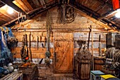 Inside red rorbu old vognskja-carriage shed dated 1925 now toalett-toilet building between Torrfiskmuseum-Stockfish Museum and Fiskevaersmuseum-Fishing Village Museum.