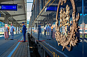Passengers of Belmond Venice Simplon Orient Express luxury train stoped at Venezia Santa Lucia railway station the central railway station in Venice Italy.