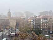 Foggy winter cityscape as temperatures go down in Zaragoza, Spain