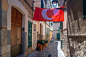 Moors and Christians flags in the interior streets of the center of Soller, Soller Majorca, Balearic Islands, Spain, Mediterranean, Europe.