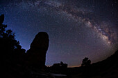 The Milky Way over sandstone towers in the Needles District of Canyonlands National Park in Utah.