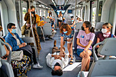 Actors performing Don Quixote de la Mancha and Dulcinea del Toboso inside the Cervantes Train between Atocha train Station and Alcala de Henares, Madrid Spain