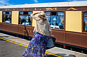 Passengers of Belmond British Pullman luxury train stoped at Folkestone train station railway station in England.