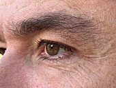 Close up photo of the eye of a 47 year old man