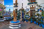 Courtyard full of plant pots, Iznajar village, Cordoba province Andalusia, southern Spain.