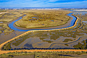 Aerial view of Salinas del Duque saltworks walking road marshes Isla Cristina, Huelva Province, Andalusia, southern Spain.