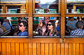 Passengers of the tren de Soller train vintage historic train that connects Palma de Mallorca to Soller, Majorca, Balearic Islands, Spain, Mediterranean, Europe.