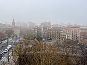 Foggy winter cityscape as temperatures go down in Zaragoza, Spain