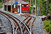 The Petit train de la Rhune rack railway, La Rhun mountain on the border with Spain, France. Train tracks of the historic funicular from 1924 up to the summit of La Rhune Mountain, 905m, Basque Country, Pyrenees