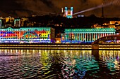 France, Rhone, Lyon, historical site listed as World Heritage by UNESCO, St Jean Cathedral, the courthouse at the edge of Saone River and Notre Dame de Fourviere Basilica during the Fete des Lumieres (Light Festival), show Reflets of Damien Fontaine on the hill of Fourviere