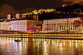 France, Rhone, Lyon, historical site listed as World Heritage by UNESCO, St Jean Cathedral, the courthouse at the edge of Saone River and Notre Dame de Fourviere Basilica during the Fete des Lumieres (Light Festival), show Reflets of Damien Fontaine on the hill of Fourviere