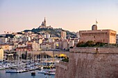 France, Bouches du Rhone, Marseille, the Old Port, Fort Saint Jean and Notre Dame de la Garde basilica