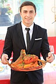 France, Bouches du Rhone, Marseille, Vieux Port, Miramar restaurant, waiter with a bouillabaisse