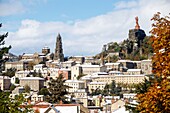 France, Haute Loire, Le Puy en Velay, step on the way to Saint Jacques de Compostela, view of the city with the statue Notre Dame de France (1860) at the top of the rock Corneille and Notre Dame Cathedral of the Annunciation of the twelfth century