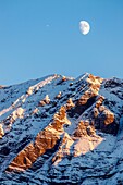 France, Hautes Alpes, Écrins National Park, Champsaur Valley, Orcieres Merlette, moonrise over the Aiguille (2793m)
