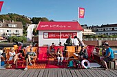 France, Seine Maritime, Veules les Roses, beach hut filled with free books and loungers facing the sea