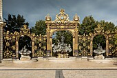 France, Meurthe et Moselle, Nancy, Stanislas square (former royal square) built by Stanislas Leszczynski, king of Poland and last duke of Lorraine in the 18th century, listed as World Heritage by UNESCO, Neptune fountain by Barthelemy Guibal and ironworks by Jean Lamour