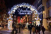 France, Bas Rhin, Strasbourg, old town listed as World Heritage by UNESCO, the large arch &#x201c;Strasbourg, Capital of Christmas&#x201d; located at the entrance of the street of the old fish market