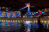 France, Rhone, Lyon, historical site listed as World Heritage by UNESCO, St Jean Cathedral, the courthouse at the edge of Saone River and Notre Dame de Fourviere Basilica during the Fete des Lumieres (Light Festival), show Reflets of Damien Fontaine on the hill of Fourviere