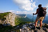 France, Haute Savoie, Dingy-Saint-Clair, hiker on the edge of the Parmelan plateau