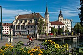 France, Haute Savoie, Annecy, the churches of Saint Francis de Sales and Saint Maurice behind the bridge of Les Halles and flower massif of the Quai de la Tournette