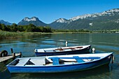 France, Haute Savoie, Lake Annecy, Verthier, boats in small fishing port of Gliere and the massif of Bauges