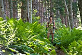 France, Haute Savoie, La Roche-sur-Foron, hiker in the Sales woods