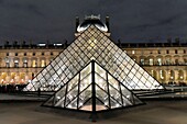 France, Paris, UNESCO World Heritage Site, the Pyramid of the Louvre by the architect Ieoh Ming Pei and facade of the Richelieu Pavilion in the Napoleon courtyard