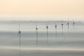 France, Vendee, Le Langon, wind turbines in the mist (aerial view)