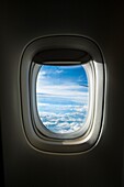 France, view of the porthole of an airplane (aerial view)