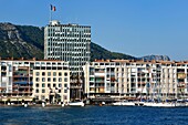 France, Var, Toulon, the port, apartment blocks designed by De Mailly following the 1944 bombing, the building of the City Hall in the background