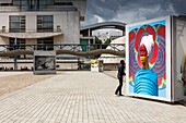 France, Paris, La Villette, La Vilette Park, scene of life in the park of La Villette in the spring during the weekend under a cloudy sky