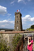 France, Territoire de Belfort, Belfort, Tour de la Miotte, little girl watching with binoculars