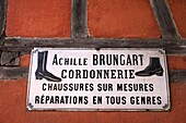 France, Haut Rhin, Ungersheim, Ecomusee d Alsace, timbered house, cobbler, enameled panel