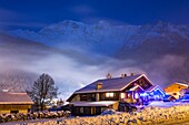 France, Haute Savoie, Massif of the Mont Blanc, the Contamines Montjoie, twilight on a chalet lit of the station and the domes of Miage
