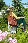 Woman entering summer garden