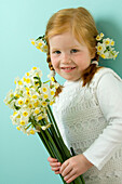 Girl holding daffodils