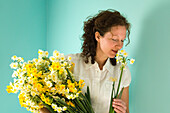Woman holding daffodils
