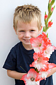 Boy holding Gladiolus