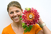 Woman holding dahlia