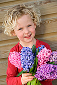 Girl holding hyacinths