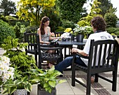 Couple sitting at a garden table