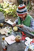 Boy coring apples