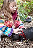 Girl with miniature pig