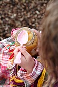 Girl eating apple sauce