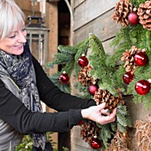 Woman making christmas decorations