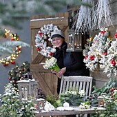 Woman making christmas arrangement