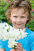 Boy holding daffodil