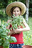 Girl holding Salvia officinalis