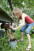 Children playing with soil